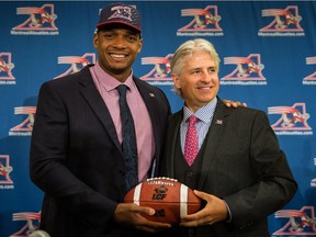 Alouettes general manager Jim Popp poses with Michael Sam during a news conference in Montreal on May 26, 2015.