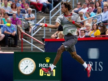 Gael Monfils (FRA) gets airborne as he returns the ball to Fabio Fognini (ITA) during Rogers Cup action in Montreal on Tuesday May 5, 2015. Monfils won the match in 2 sets.