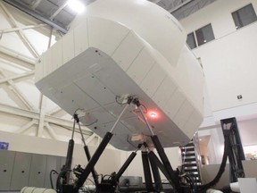 A full-flight simulator in a training area at the headquarters of CAE in the St. Laurent area of Montreal on May 6, 2015.