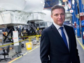 Marc Parent, president and chief executive officer of CAE, near flight simulators at the company's  headquarters in the St. Laurent area of Montreal.
