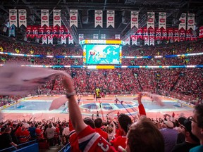 Canadiens fans cheer as the team takes the ice before the start of Game 5 of the Eastern Conference semifinal series against the Tampa Bay Lightning at the Bell Centre in Montreal on May 9, 2015.