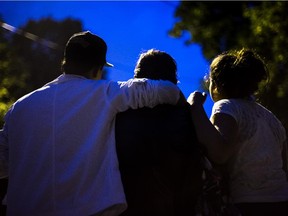 Undocumented Mexican immigrant family Monica, centre, and her children 14 year-old Mariana, right, and her 15 year-old brother Oscar, left, pose for a photograph in Montreal on Wednesday, September 11, 2013.