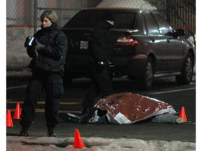 Montreal Police at the scene of a double murder on Jan. 24, 2010, in the parking lot of a fast-food restaurant in N.D.G. Two men -- Kirk Murray and Antonio Onesi -- were killed.