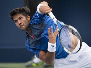 Fernando Verdasco of Spain serves to Nick Kyrgios of Australia during first round of play at the Rogers Cup tennis tournament Tuesday August 11, 2015 in Montreal.