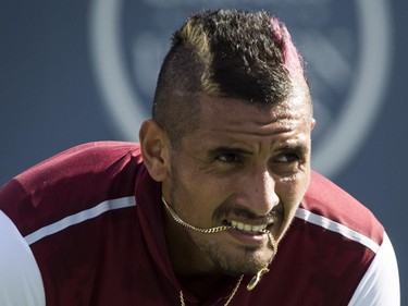 Nick Kyrgios, of Australia, awaits a serve from John Isner, of The United States, during round of sixteen play at the Rogers Cup tennis tournament on Thursday, August 13, 2015, in Montreal.