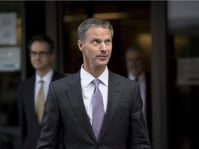 Nigel Wright, former Chief of Staff to Prime Minister Stephen Harper, leaves the courthouse in Ottawa following his sixth day of testimony at the trial of former Conservative Senator Mike Duffy on Wednesday, Aug. 19, 2015.