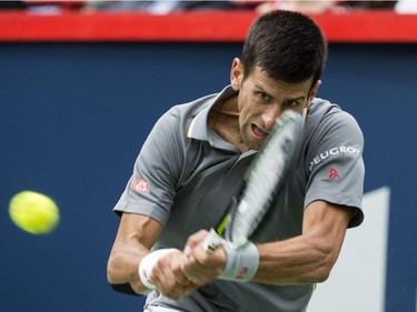 Novak Djokovic, of Serbia, returns to Jack Sock, of the United States, during round of sixteen play at the Rogers Cup tennis tournament Thursday August 13, 2015 in Montreal.