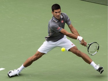 Novak Djokovic, of Serbia, returns to Jack Sock, of the United States, during round of sixteen play at the Rogers Cup tennis tournament Thursday August 13, 2015 in Montreal.