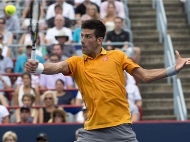 Novak Djokovic, of Serbia, returns to Jeremy Chardy, of France, during the semifinals at the Rogers Cup tennis tournament on Saturday, August 15, 2015 in Montreal. Djokovic won 6-4, 6-4 to move on to the final.