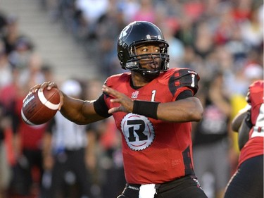Ottawa Redblacks Henry Burris (1) plays the ball against the Montreal Alouettes during the first half of a CFL game in Ottawa on Friday, Aug. 7, 2015.