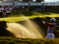 Jason Day of Australia plays a bunker shot on the 15th hole during the third round of the 2015 PGA Championship at Whistling Straits  at  on August 15, 2015, in Sheboygan, Wis.