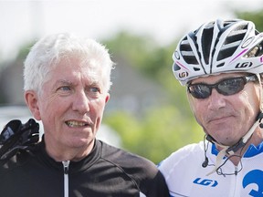 Bloc Quebecois Leader Gilles Duceppe, left, talks with Parti Quebecois leader Pierre Karl Peladeau prior to setting off on their bicycles in Repentigny, Que.