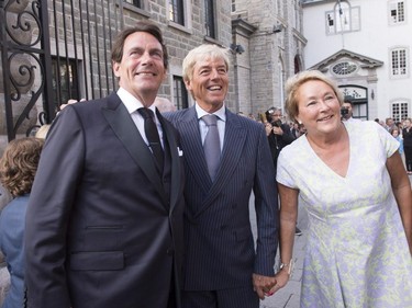 Parti Québécois Leader Pierre-Karl Peladeau, left, poses with former Quebec premier Pauline Marois and her husband, Claude Blanchet, before his wedding to Julie Snyder on Saturday, August 15, 2015, in Quebec City.