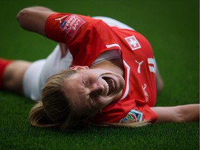 Would you really want to feel her pain?: Switzerland's Rachel Rinast screams in agony after colliding with a member of the Ecuador team during FIFA World Cup soccer action in Vancouver on June 12, 2015.