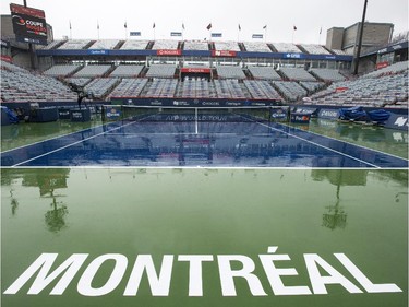 Rain pours down on centre court delaying play at the Rogers Cup tennis tournament Tuesday, August 11, 2015 in Montreal.