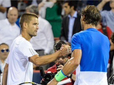 Mikhail Youzhny of Russia congratulates Rafael Nadal of Spain on his victory during day four of the Rogers Cup at Uniprix Stadium on August 13, 2015 in Montreal, Quebec, Canada.  Rafael Nadal defeated Mikhail Youzhny 6-3, 6-3.