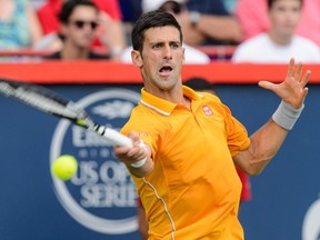 Novak Djokovic of Serbia hits the ball against Jeremy Chardy of France during day six of the Rogers Cup at Uniprix Stadium on August 15, 2015, in Montreal.