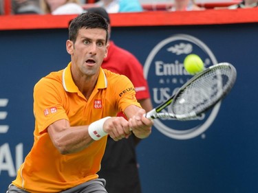 Novak Djokovic of Serbia hits a return against Jeremy Chardy of France during day six of the Rogers Cup at Uniprix Stadium on August 15, 2015 in Montreal, Quebec, Canada. Novak Djokovic defeated Jeremy Chardy 6-4, 6-4.