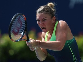 Simona Halep of Romania plays a shot against Sara Errani of Italy during Day 6 of the Rogers Cup at the Aviva Centre on Aug. 15, 2015, in Toronto.