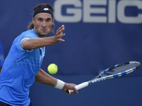 Ruben Bemelmans of Belgium lost to Brayden Schnur 6-4, 6-3 in the first round of the qualifying event for the Rogers Cup Canadian Open men’s tennis championships on Saturday, August 8, 2015, in Montreal.