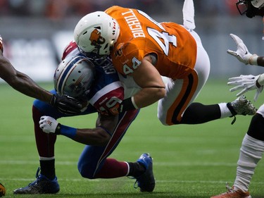 B.C. Lions' Adam Bighill (44) tackles Montreal Alouettes' S.J. Green during the first half of a CFL football game in Vancouver, B.C., on Thursday August 20, 2015.
