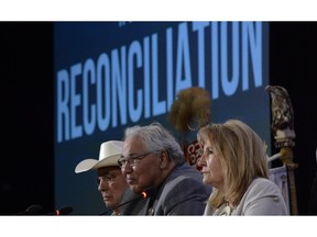 Commission chairman Justice Murray Sinclair (centre) and fellow commissioners Marie Wilson (right) and Wilton Littlechild discuss the commission's report on Canada's residential school system at the Truth and Reconciliation Commission in Ottawa on Tuesday, June 2, 2015.