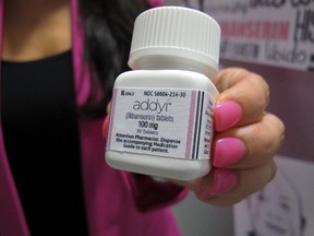 Sprout Pharmaceuticals CEO Cindy Whitehead holds a bottle for the female sex-drive drug Addyi at her Raleigh, N.C., office on Tuesday, Aug. 15, 2015. After two rejections, the U.S. Food and Drug Administration gave approval Tuesday for the drug, also known as flibanserin, as a treatment for hypoactive sexual desire disorder, a first for women.