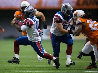 Montreal Alouettes' Stefan Logan rushes for a first down against the B.C. Lions during the first half of a CFL football game in Vancouver, B.C., on Thursday August 20, 2015.