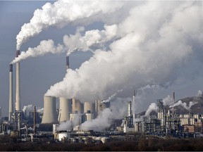 (FILE - In this Dec. 16, 2009 file photo, steam and smoke rise from a coal burning power plant in Gelsenkirchen, Germany.