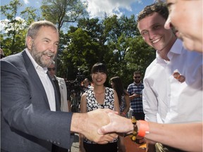 NDP Leader Thomas Mulcair greets a supporter during a federal election campaign stop in Saint Jerome, Que., on Saturday, August 22, 2015.