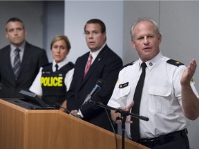 Toronto Police Staff Superintendent Bryce Evans (right) speaks to members of the media at Toronto Police Headquarters about the ongoing investigation into the Ashley Madison hack which has seen users personal information from the site leaked to the general public as Agent Ron Marcell US D.H.L.S (second right), OPP Inspector Lisa Taylor  and Toronto Technical Crimes Detective John Menard look on, Monday August 24, 2015.