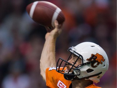 B.C. Lions' quarterback Travis Lulay passes against the Montreal Alouettes during the first half of a CFL football game in Vancouver, B.C., on Thursday August 20, 2015.