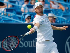 Mardy Fish returns a shot to Viktor Troicki of Serbia during Day 3 of the Western and Southern Open at the Linder Family Tennis Center on August 17, 2015 in Cincinnati, Ohio.