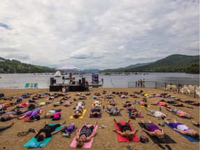 Yoga at the Tremblant Beach and Tennis Club is part of Wanderlust, a four-day wellness festival from Aug. 20 to 23 at the slope-side Tremblant mountain resort.