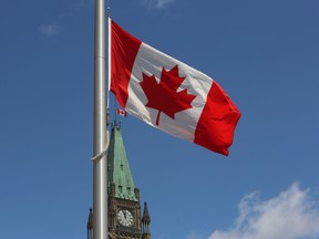 The flag above the Peace Tower, and other buildings on Parliament Hill, flies at half staff marking the National Day of Remembrance for Victims of Terrorism in Ottawa Tuesday, June 23, 2015. .THE CANADIAN PRESS/Fred Chartrand