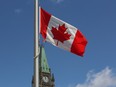The flag above the Peace Tower, and other buildings on Parliament Hill, flies at half staff marking the National Day of Remembrance for Victims of Terrorism in Ottawa Tuesday, June 23, 2015. .THE CANADIAN PRESS/Fred Chartrand