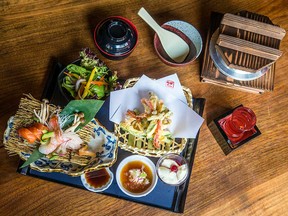 The Bento Box dish at Izakaya Kabocha, a lunchtime favourite, includes chicken, salad, tempura vegetables with sashimi sauce and berry coulis. It is paired with lychee sake.