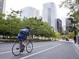 A cyclist rolls down a bicycle lane in downtown Montreal.