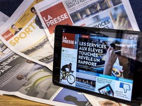 A tablet is seen on the paper edition of La Presse Wednesday, September 16, 2015 in Montreal.