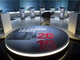 A technician cleans the set in preparation for Thursday night's French language leaders debate  Wednesday, Sept. 23, 2015 in Montreal.