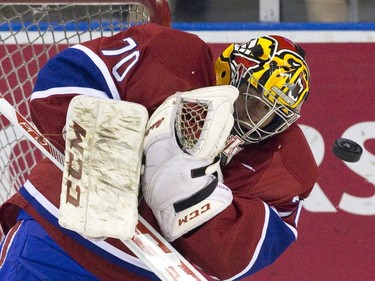 A Toronto Maple Leafs shot bounces off of Montreal Canadiens goaltender Michael McNiven during their NHL Rookie Tournament hockey game at Budweiser Gardens in London, Ont., on Saturday, September 12, 2015.