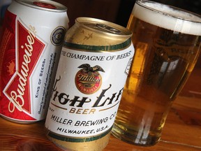 In this photo illustration, cans of Miller High Life and Budweiser beer that are products of SABMiller and Anheuser-Busch InBev (respectively) are shown on September 15, 2014 in Chicago. Illinois. Shares of SABMiller have surged to an all-time high today on speculation of a takeover bid by Anheuser-Busch InBev, the world's largest brewer.  (Photo Illustration by Scott Olson/Getty Images)