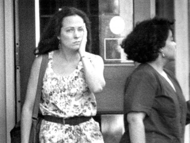 A distraught woman leaves Concordia University's Hall building August 24, 1992 after the shootings by Valery Fabrikant.