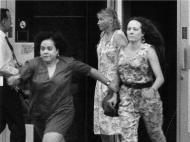 Two women run from Concordia University's Hall building August 24, 1992 after the shootings by Valery Fabrikant.