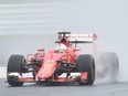 Ferrari driver Sebastian Vettel of Germany drives his car during the second practice session for the Formula One Japanese Grand Prix in Suzuka on Sept. 25, 2015.