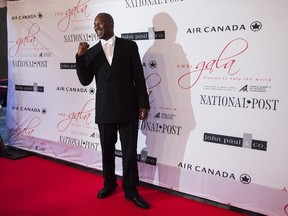 Lennox Lewis poses for a photo on the red carpet for the AMBI Benefit Gala/Cinema to Help The World event in Support of The Prince Albert II of Monaco Foundation in Toronto on Sept. 9, 2015.