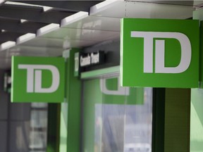 The logo of Toronto-Dominion Bank (TD) is displayed outside a Canada Trust branch in Vancouver, British Columbia, Canada, on Tuesday, Feb. 25, 2014. Toronto-Dominion is scheduled to release earnings figures on Feb. 27. Photographer: Ben Nelms/Bloomberg ORG XMIT: POS2014022710542671