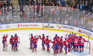The Montreal Canadiens celebrate after beating the Pittsburgh Penguins in their preseason NHL match at the Centre Vidéotron in Quebec City on Monday, Sept. 28, 2015.