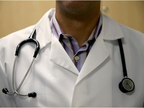 A doctor wears a stethoscope.
