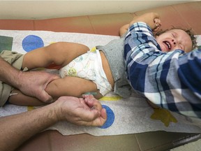 FILE - In this Jan. 29, 2015, file photo, pediatrician Dr. Charles Goodman vaccinates 1 year- old Cameron Fierro with the measles-mumps-rubella vaccine, or MMR vaccine at his practice in Northridge, Calif. California's Assembly on Thursday, June 25, 2015, approved a hotly contested bill requiring that nearly all public schoolchildren be vaccinated, clearing one of its last major legislative obstacles before the measure heads to the desk of Gov. Jerry Brown. The bill aims to increase immunization rates after a measles outbreak linked to Disneyland in December sickened over 100 people in the U.S. and Mexico.